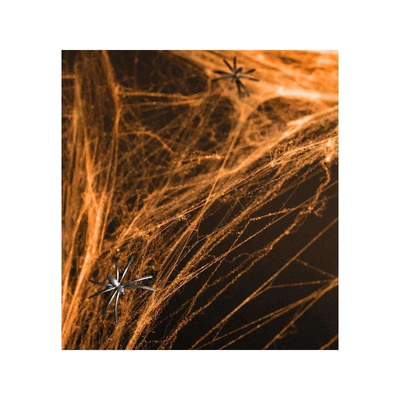 Orange Halloween spider web decoration – stretchy synthetic web for spooky party setups